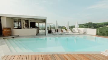 Outdoor pool, pool umbrellas, sun loungers
