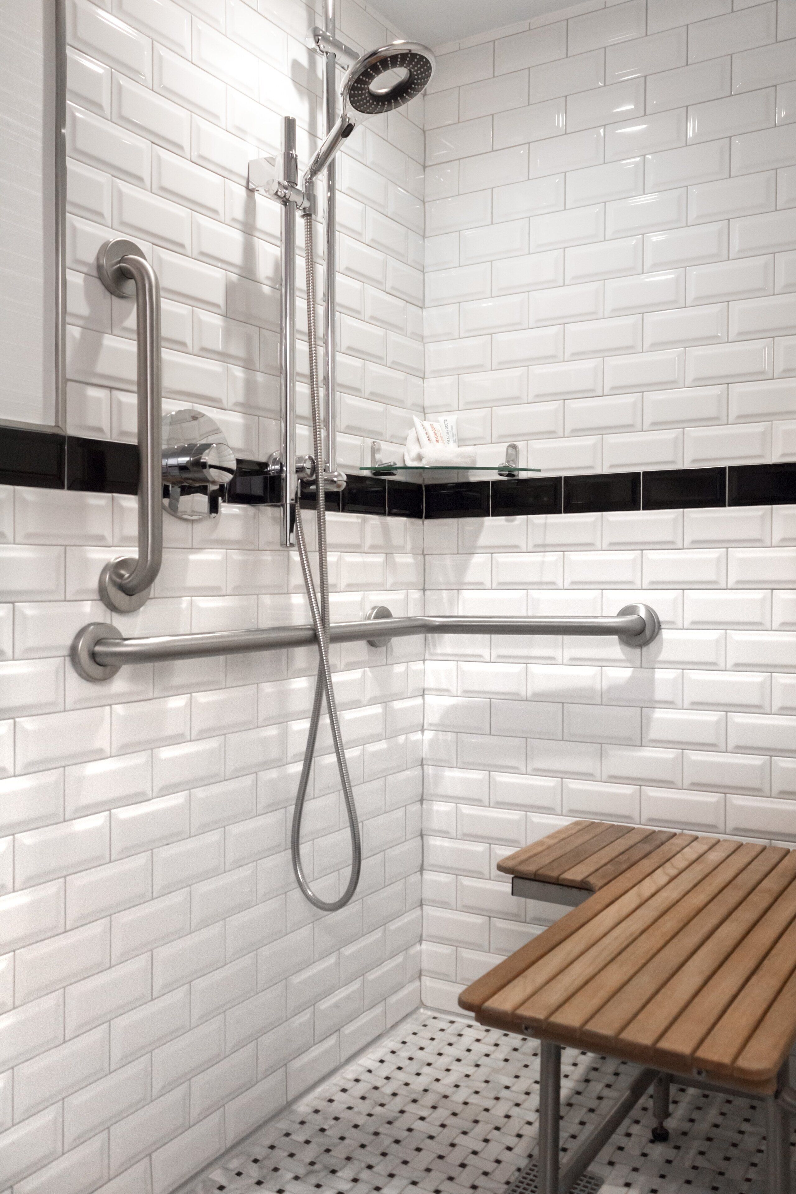 classic king mobility and hearing accessible guest room with transfer shower | accessible bathroom