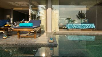 Relax by the pool with a refreshing drink and a view of the city.