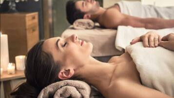 Guests can enjoy soothing massages on comfortable treatment tables in a serene spa setting.