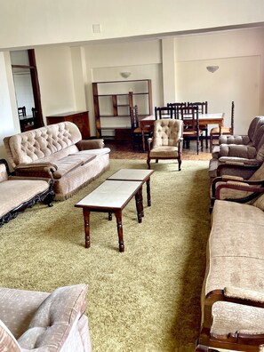 Penthouse | Living area | 42-inch LED TV with cable channels, TV - Kenya Comfort Suites (Nairobi)