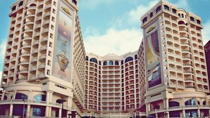 A hotel with multiple floors, balconies, and large windows. - Tolip Alexandria (Alexandria)