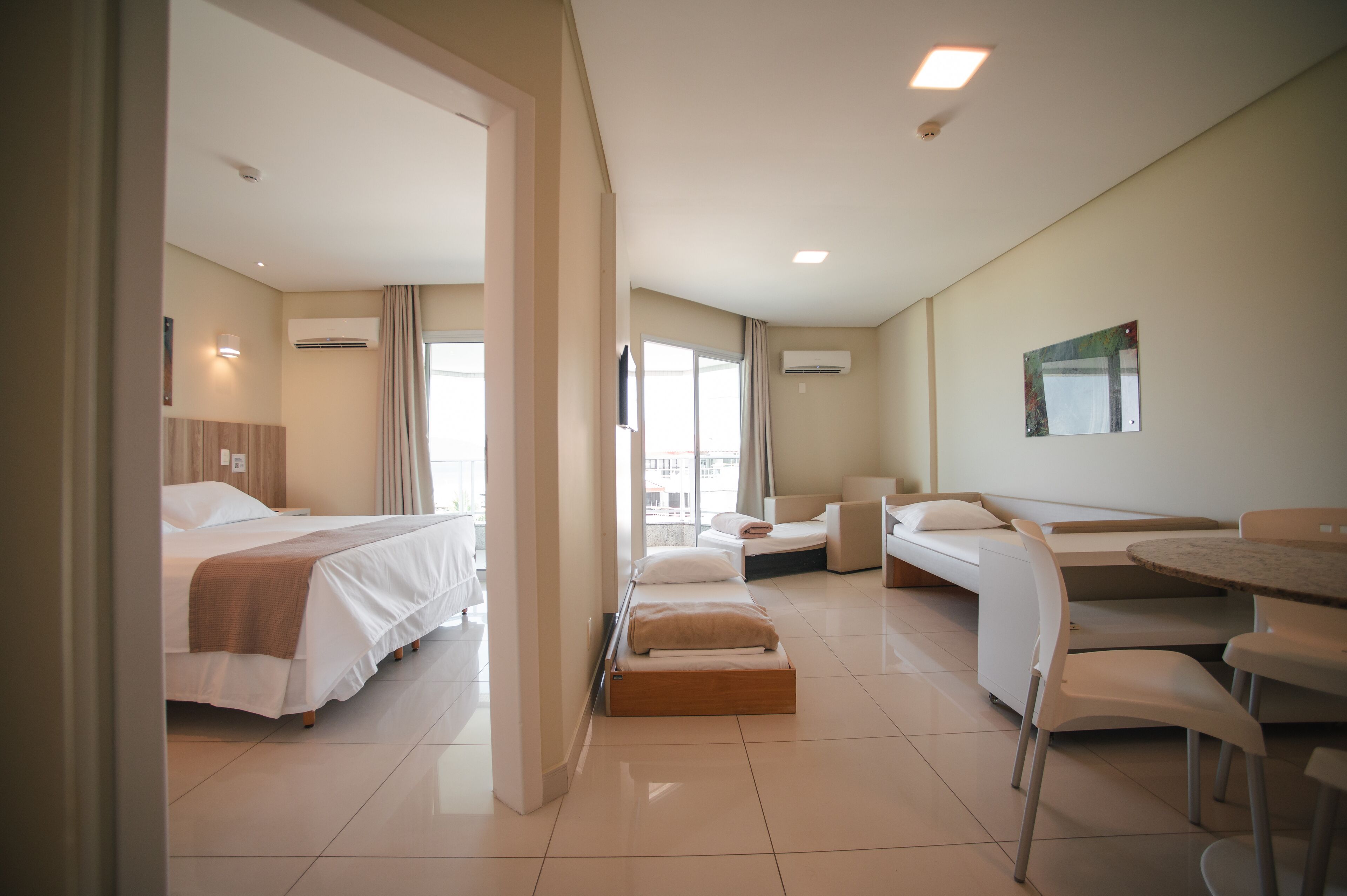 family room | 1 bedroom, minibar, in-room safe, desk