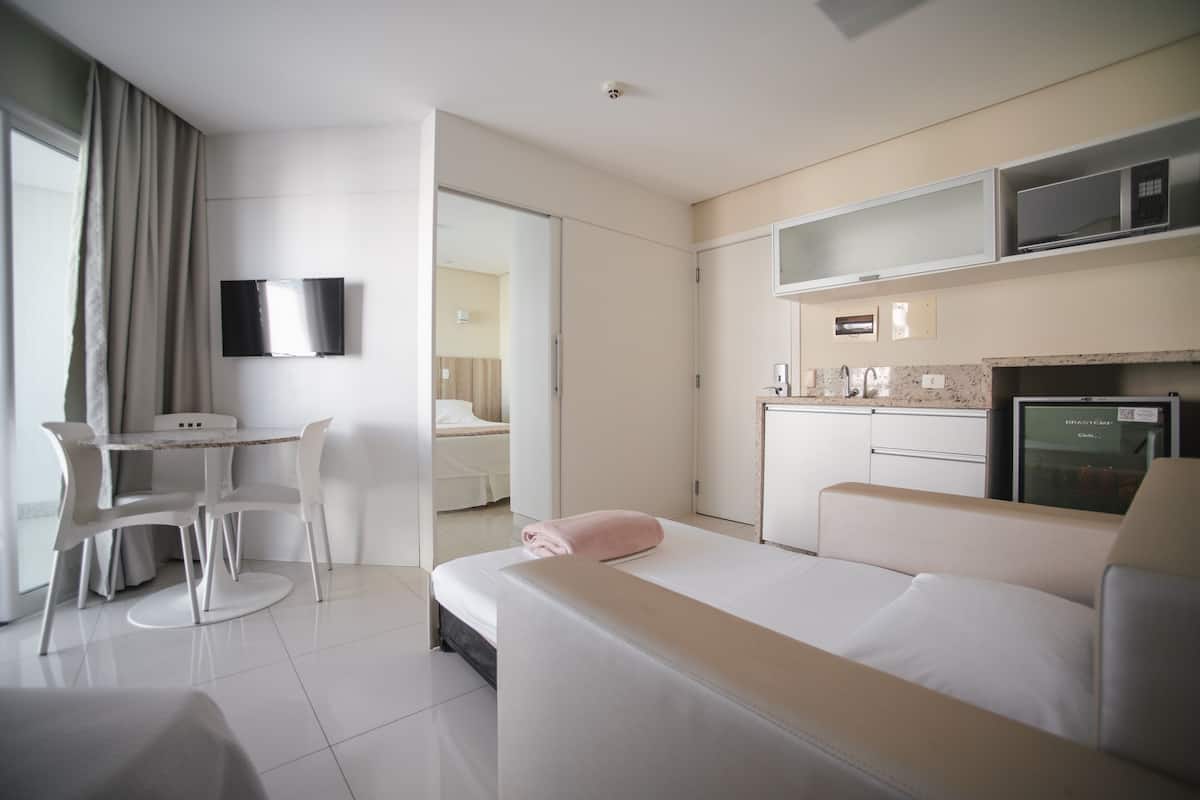 Superior Triple Room | Minibar, in-room safe, desk, blackout curtains
