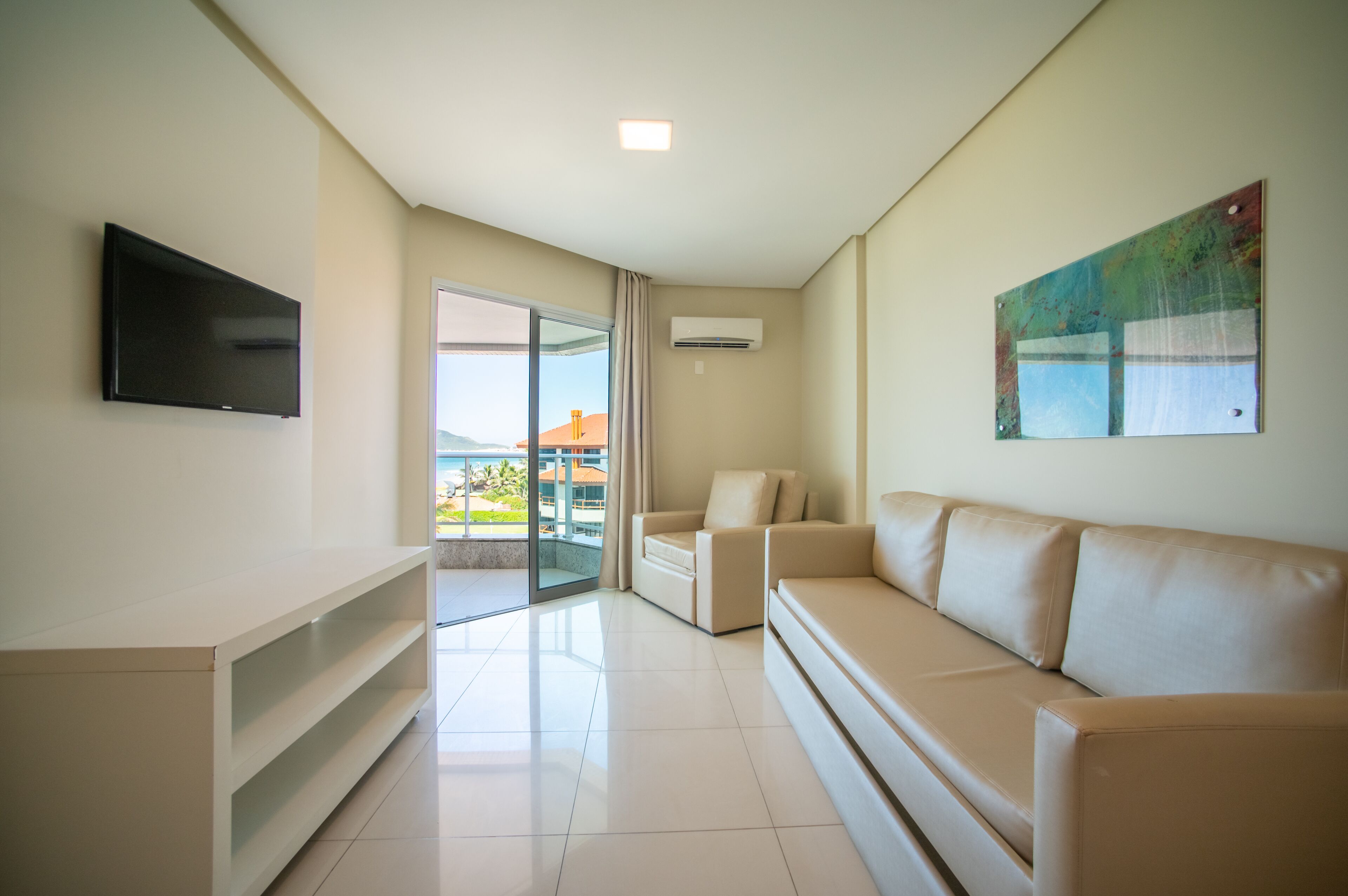 family room | 1 bedroom, minibar, in-room safe, desk