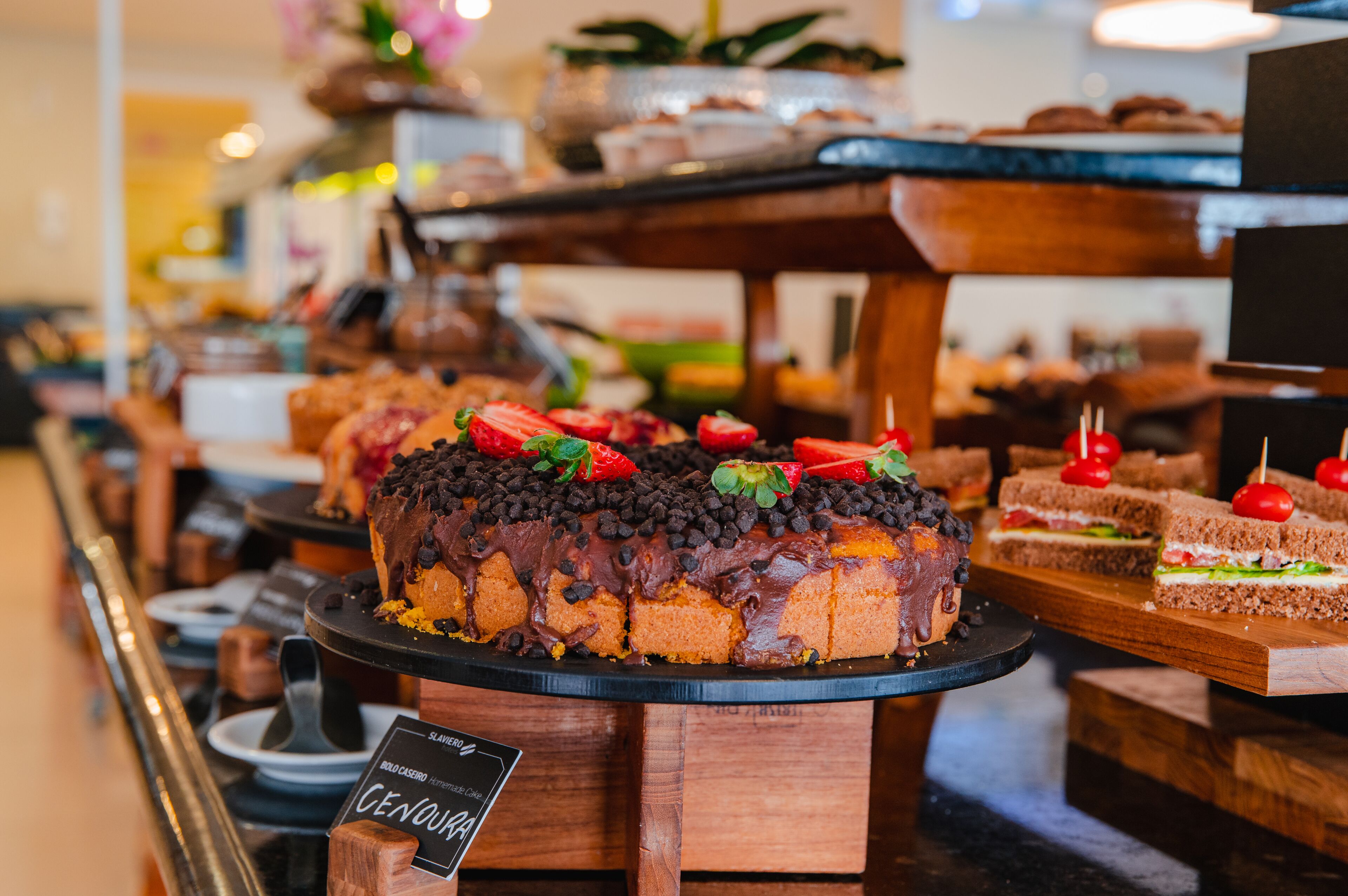 A dessert display with various cakes and pastries.
