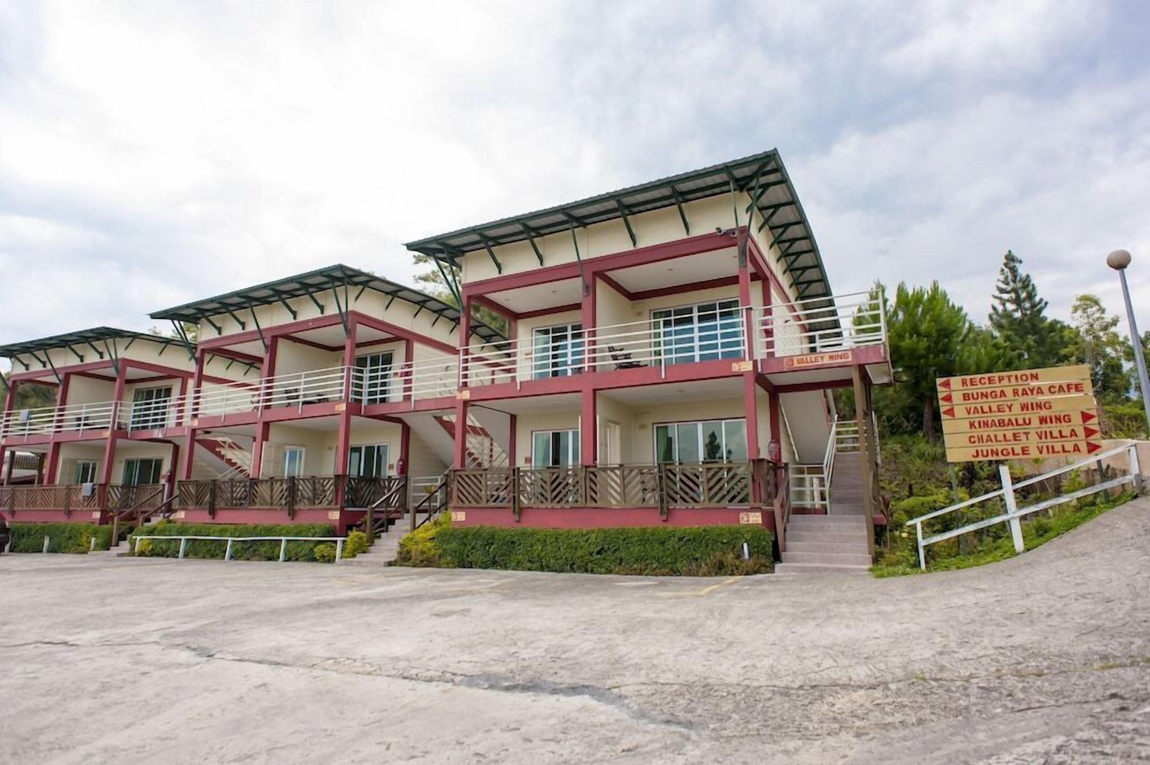 A multi-story building with a reception area, balconies, and a staircase leading to the upper floors.