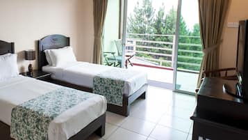Desk, iron/ironing board, bed sheets