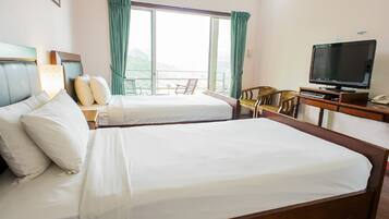 Desk, iron/ironing board, bed sheets