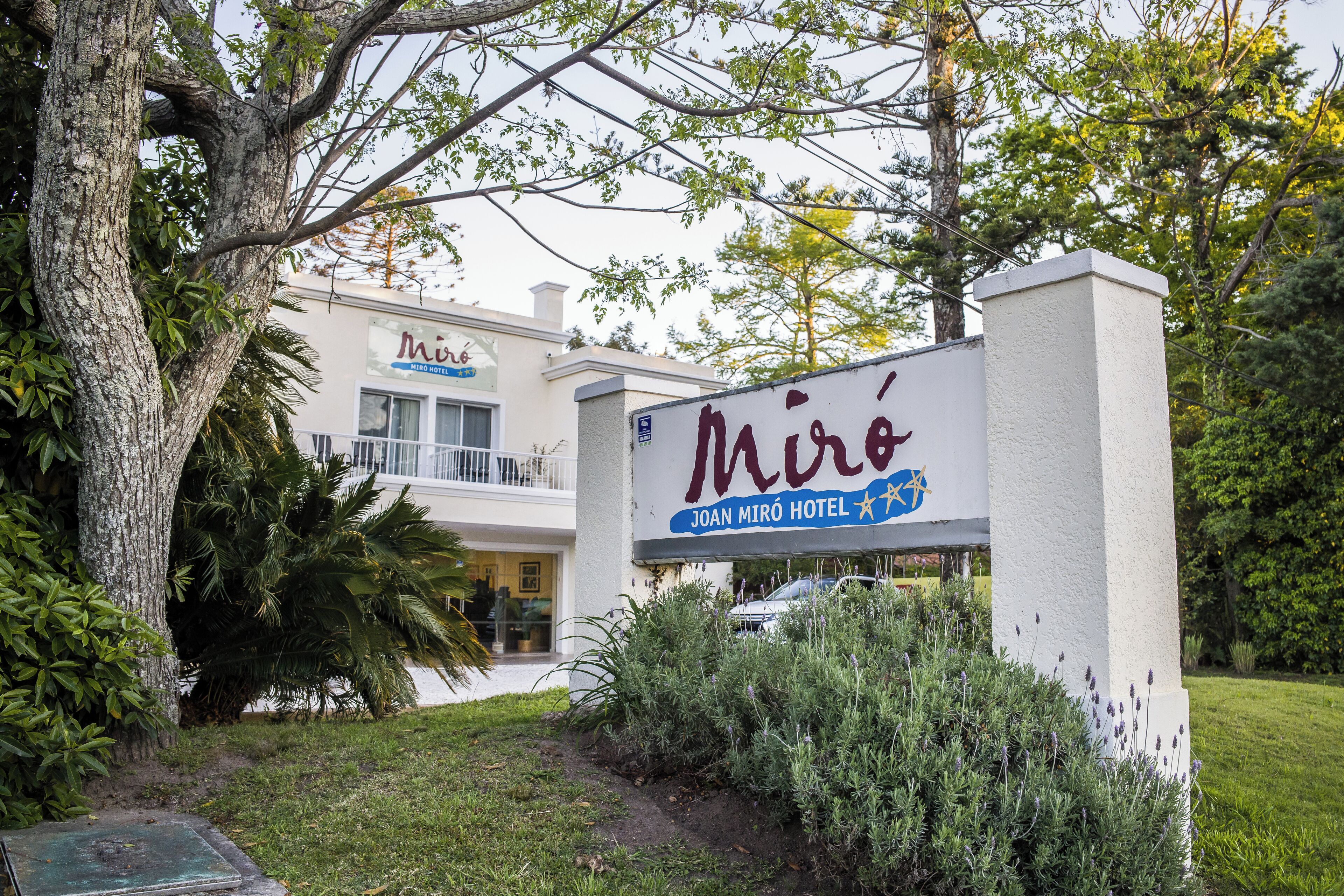 A hotel sign with the name 'Miró' and 'Joan Miró Hotel' written on it.