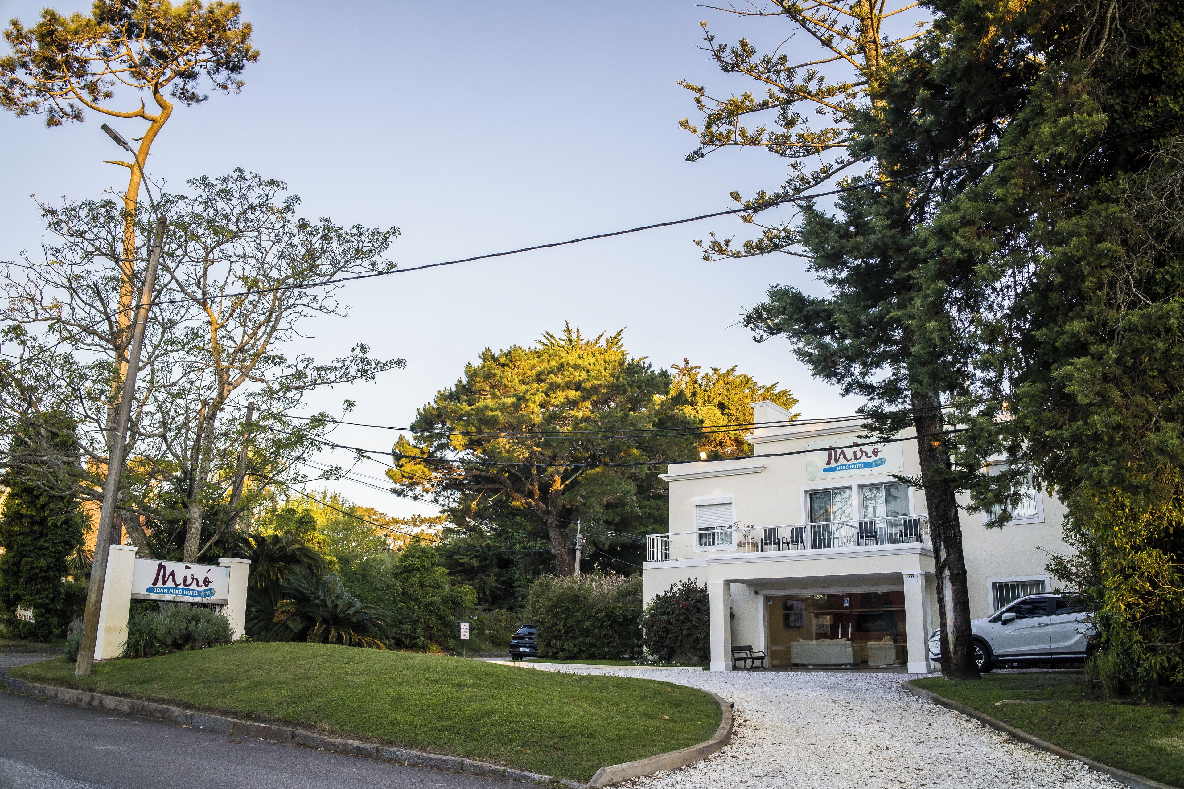 A two-story building with a sign that reads "Miro."