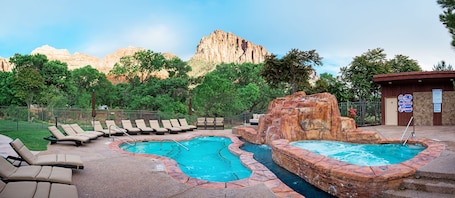 2 outdoor pools, open 8 AM to 10 PM, pool umbrellas, sun loungers. Cliffrose Springdale, Curio Collection by Hilton