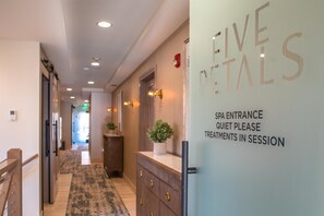 A hallway with a sign reading "SPA ENTRANCE" and "QUIET PLEASE" indicating a spa area.