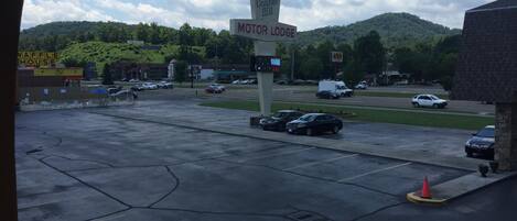 A parking lot with a sign for Conner Hill Motor Lodge.