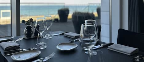 Breakfast, lunch, dinner served; beach views