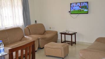 Deluxe Apartment, 2 Bedrooms | Living area | LCD TV