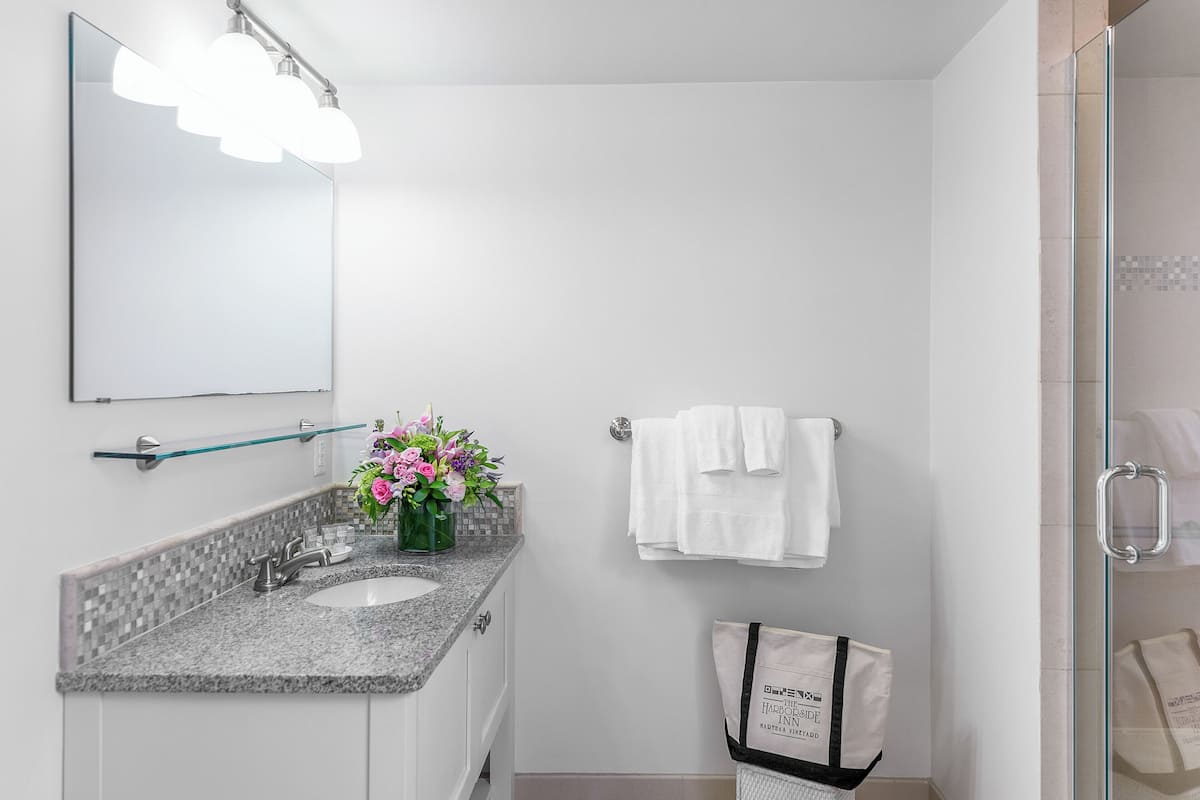 Shower, hair dryer, slippers, towels