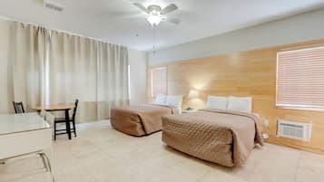 Standard Triple Room, 2 Double Beds | Individually furnished, desk, blackout drapes, soundproofing