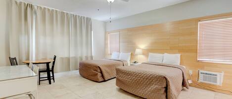 Standard Triple Room, 2 Double Beds | Individually furnished, desk, blackout drapes, soundproofing