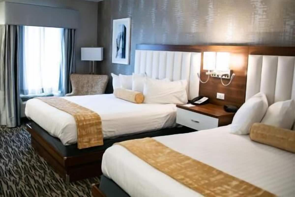 Desk, laptop workspace, blackout drapes, iron/ironing board