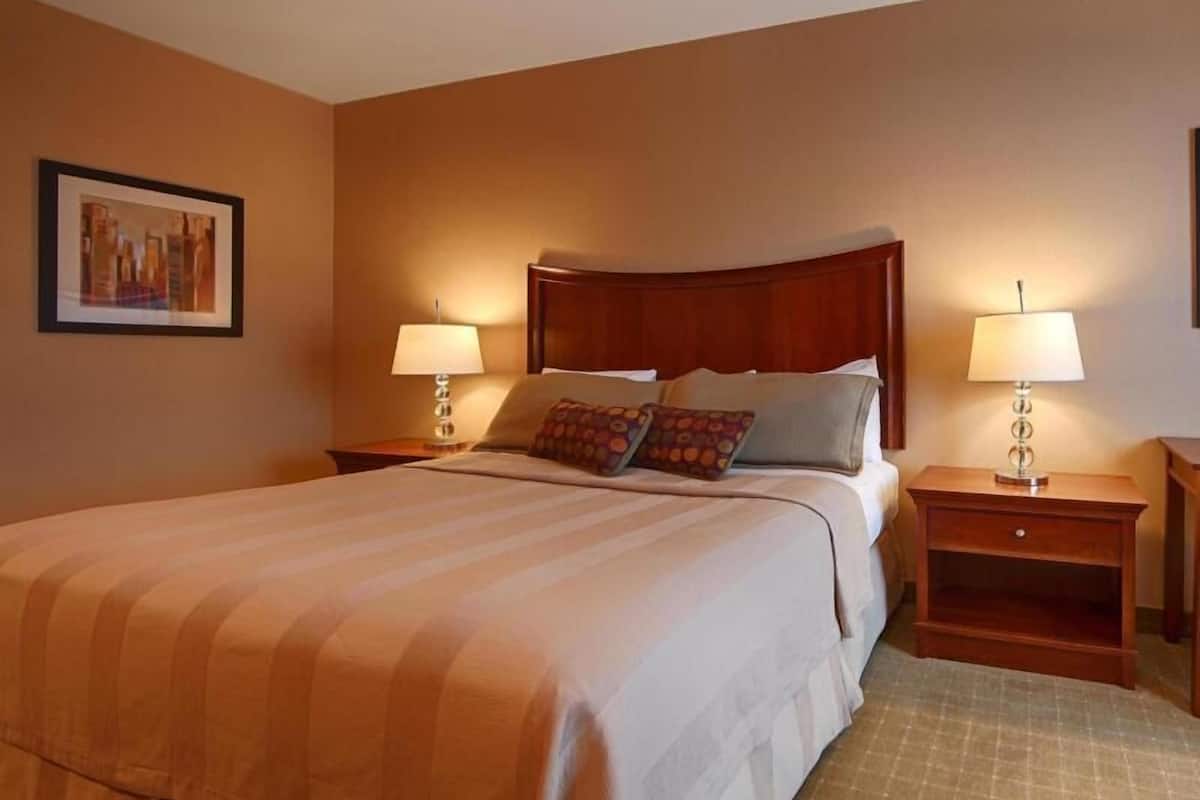 Desk, laptop workspace, blackout drapes, iron/ironing board