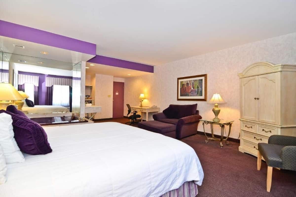 Desk, laptop workspace, blackout drapes, iron/ironing board