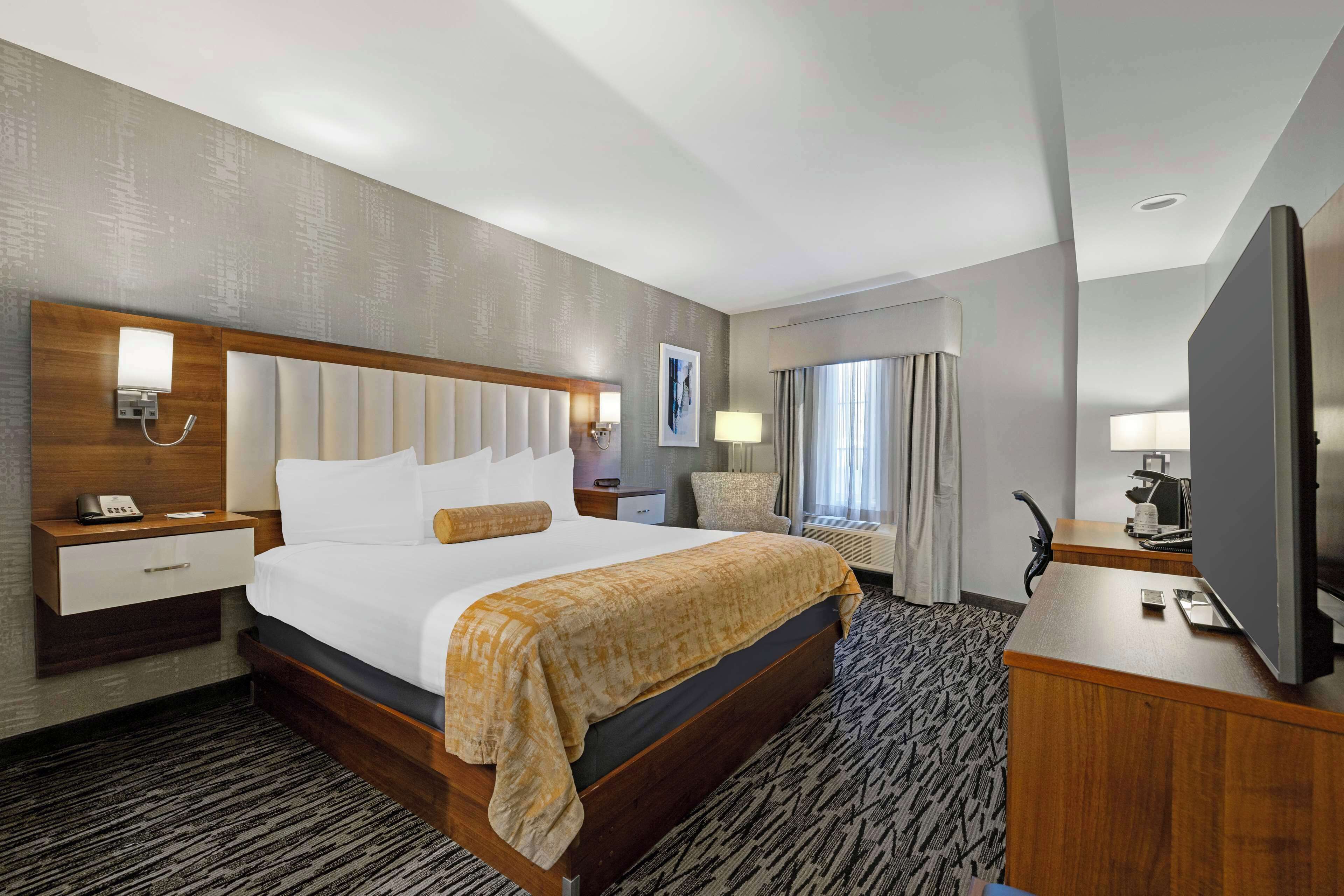 desk, laptop workspace, blackout curtains, iron/ironing board