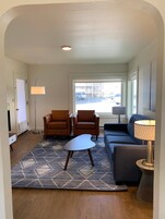 Courtyard Suite | Living room | 55-inch flat-screen TV with cable channels, TV