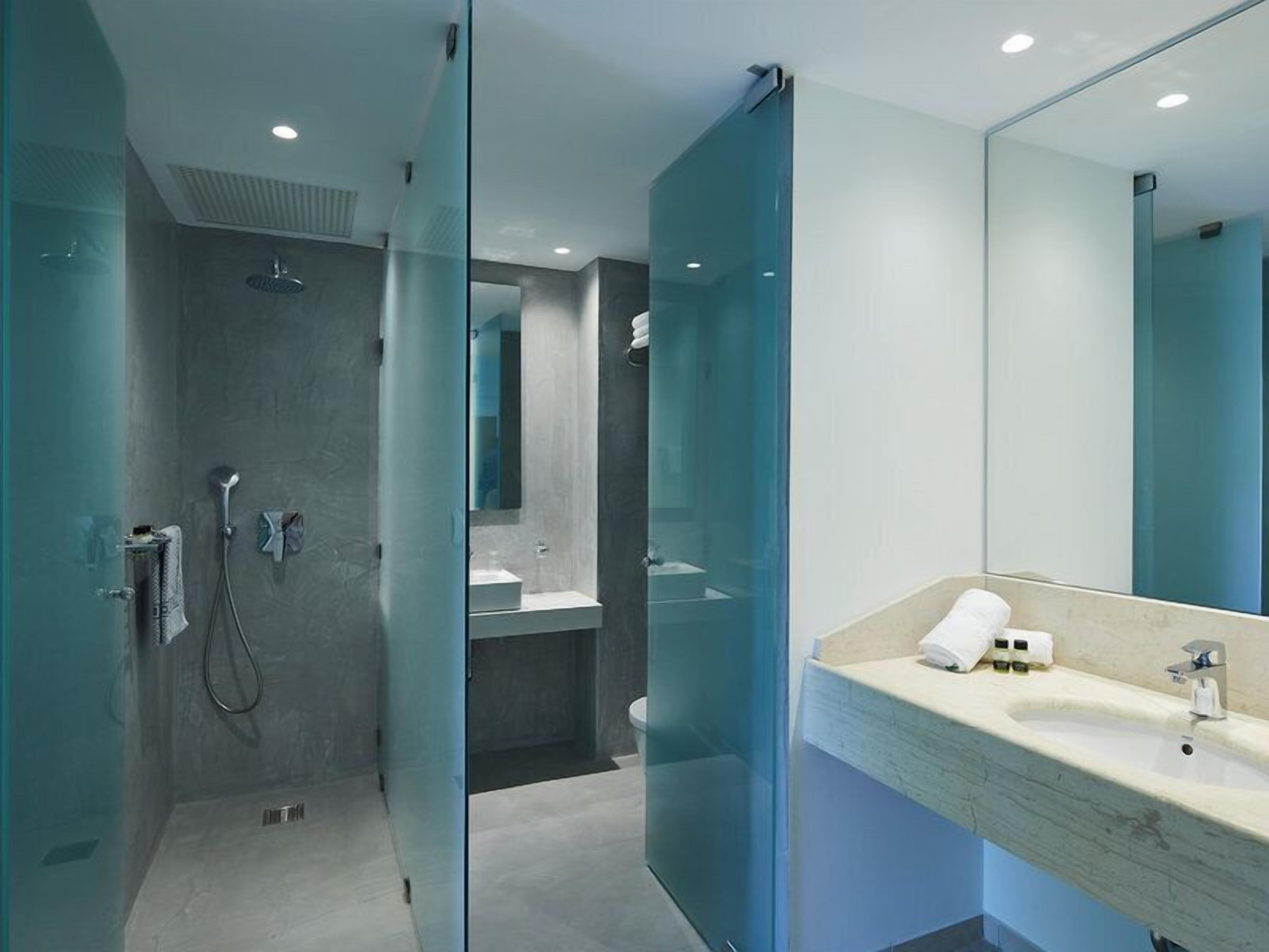 apartment, 1 bedroom, garden view (sliding door) | bathroom | bathtub, free toiletries, hair dryer, towels