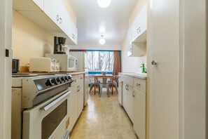 Suite, 1 Bedroom | Private kitchen | Full-size fridge, microwave, oven, coffee/tea maker - English Bay Hotel (Vancouver)