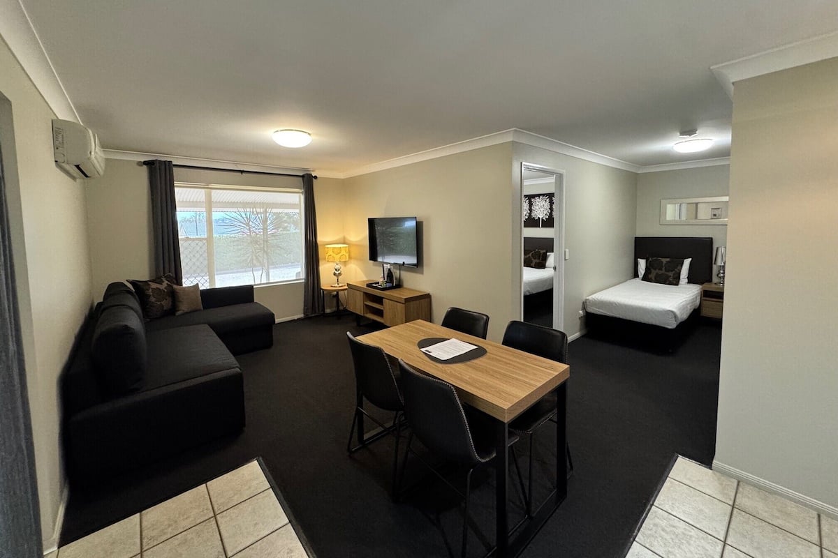 1 Bedroom Apartment | Living area | 43-inch LCD TV with digital channels, TV, Netflix