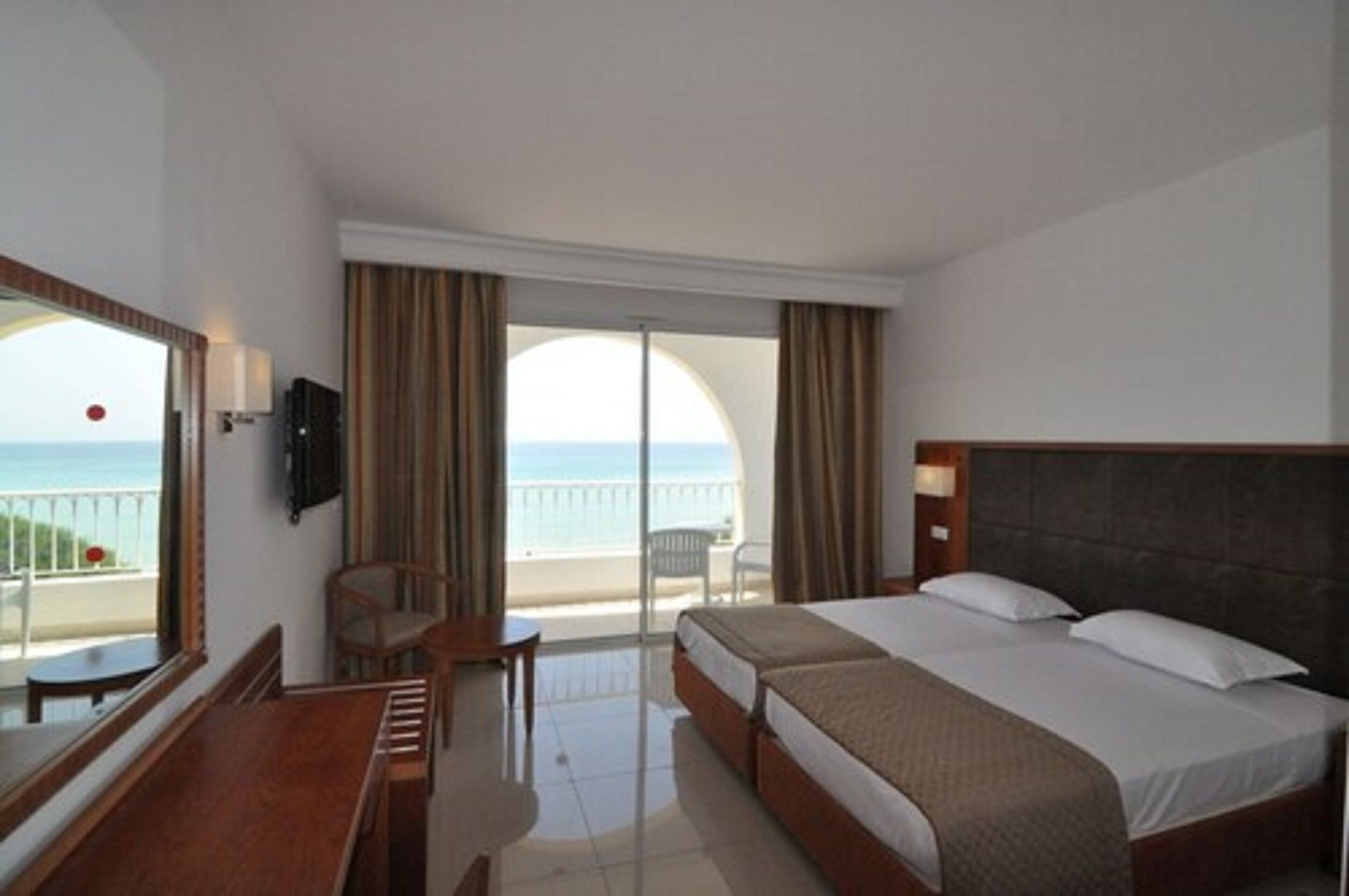 double room, sea view | minibar, in-room safe, desk, blackout curtains