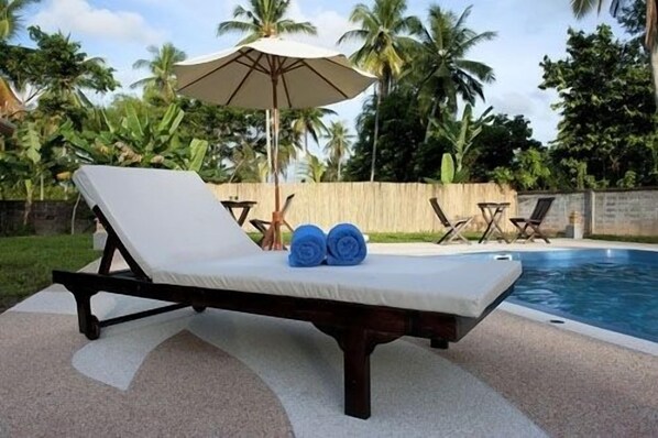 Outdoor pool, pool umbrellas, pool loungers