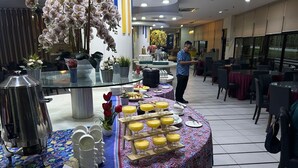 A buffet setup with a variety of dishes and a coffee station. - Hotel Seri Malaysia Genting Highlands (Genting Highlands)