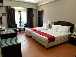 Family Room | Minibar, in-room safe, bed sheets