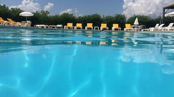 Outdoor pool, open 9:00 AM to 7:00 PM, pool umbrellas, sun loungers