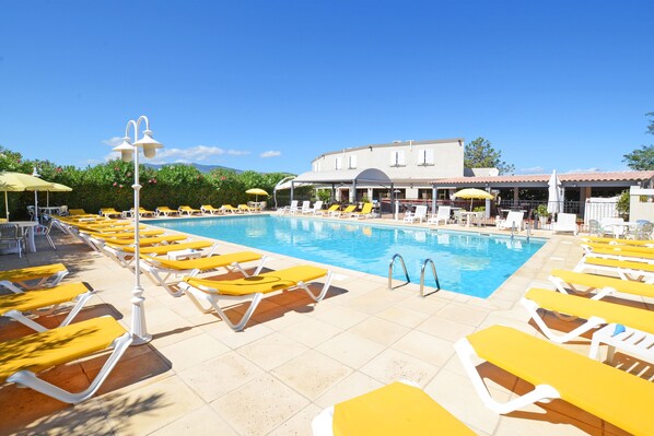 Outdoor pool, open 9:00 AM to 7:00 PM, pool umbrellas, pool loungers