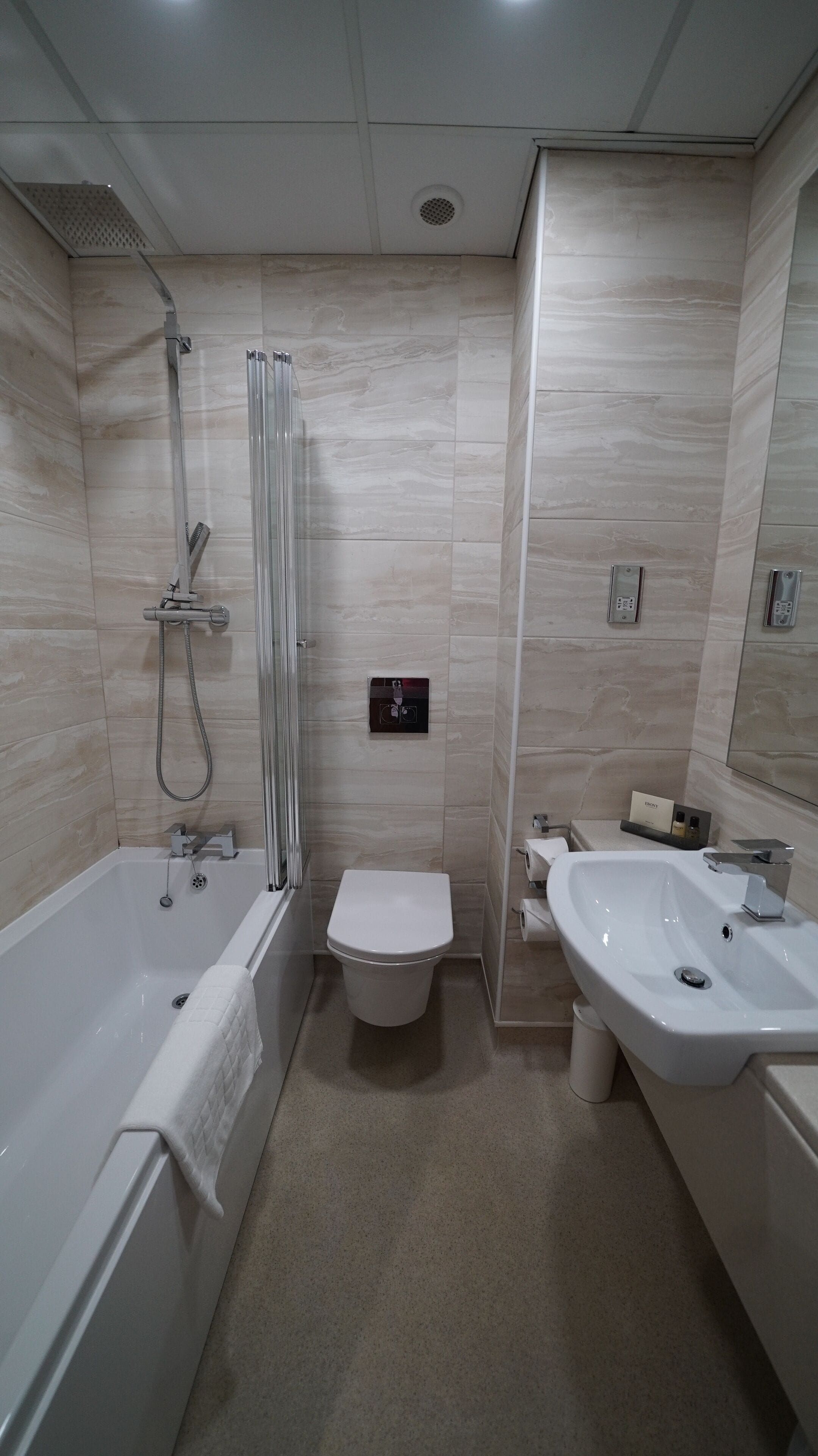 combined shower/bathtub, free toiletries, hair dryer, towels