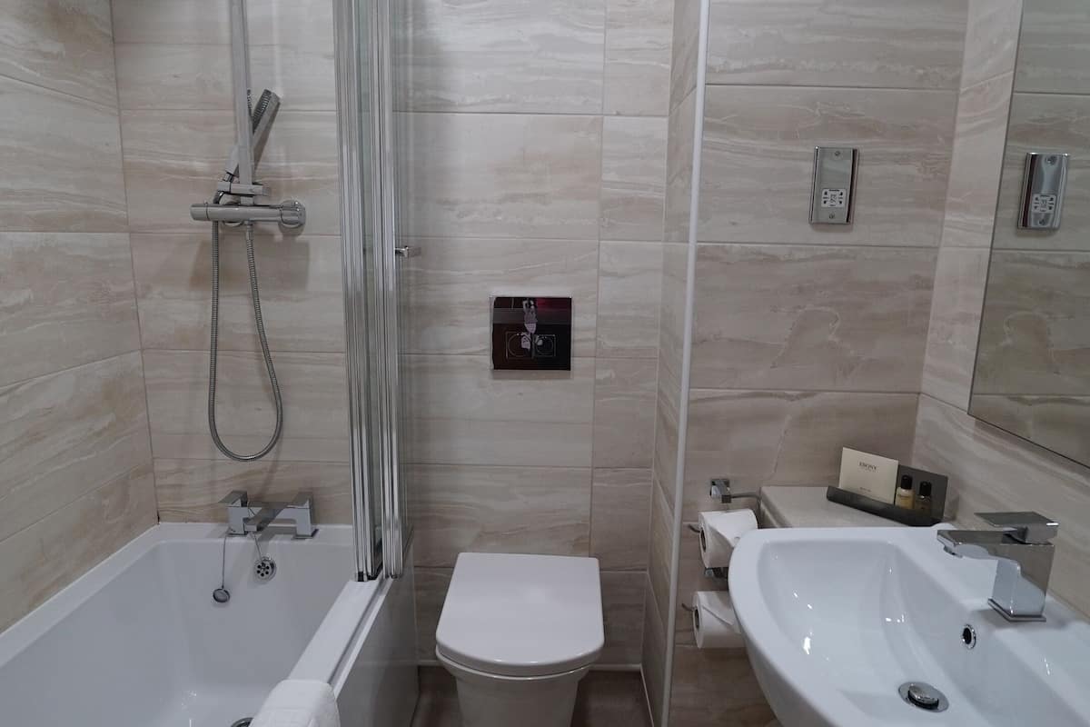 combined shower/bathtub, free toiletries, hair dryer, towels