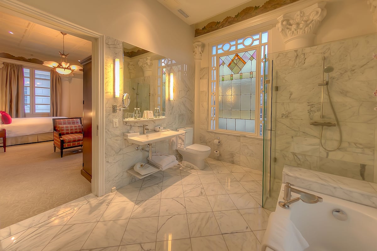 premium room, 1 king bed | bathroom | combined shower/bathtub, free toiletries, hair dryer, bathrobes