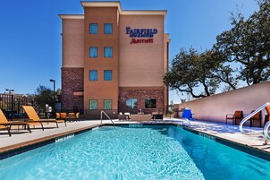 Outdoor pool, open 9:00 AM to 8:00 PM, pool loungers