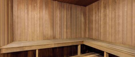 A sauna with wooden walls and benches.