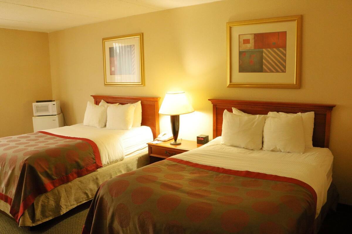 Pillowtop beds, desk, blackout drapes, iron/ironing board