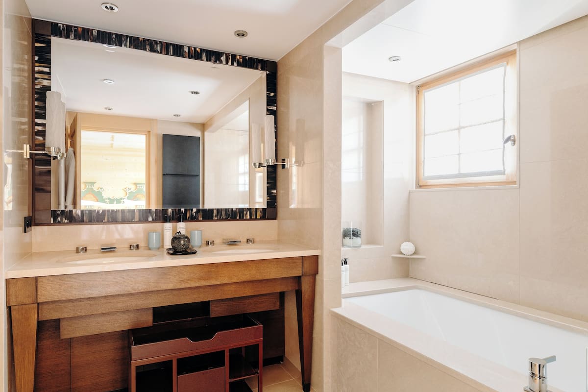 Separate tub and shower, designer toiletries, hair dryer, bathrobes