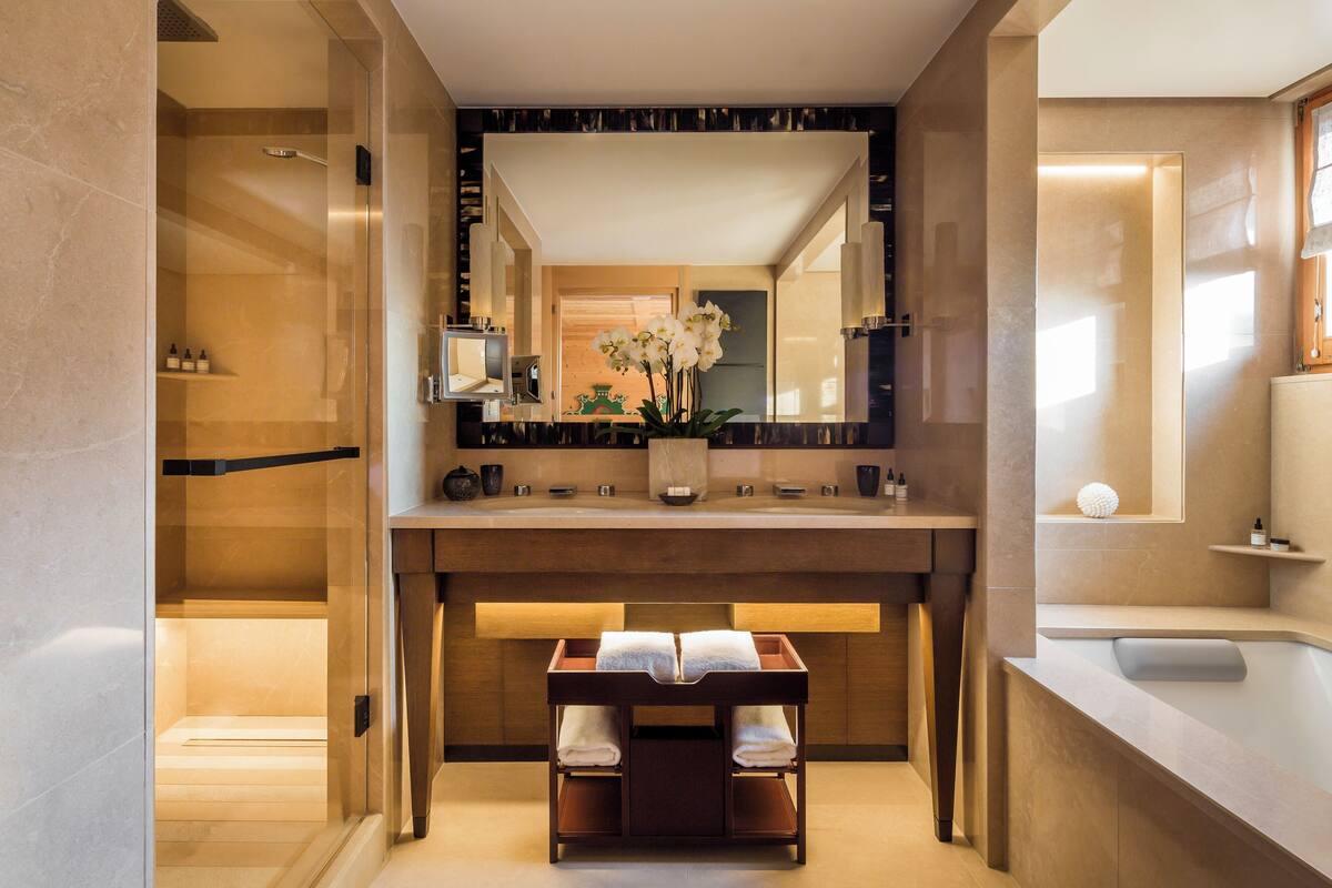 separate bathtub and shower, designer toiletries, hair dryer, bathrobes