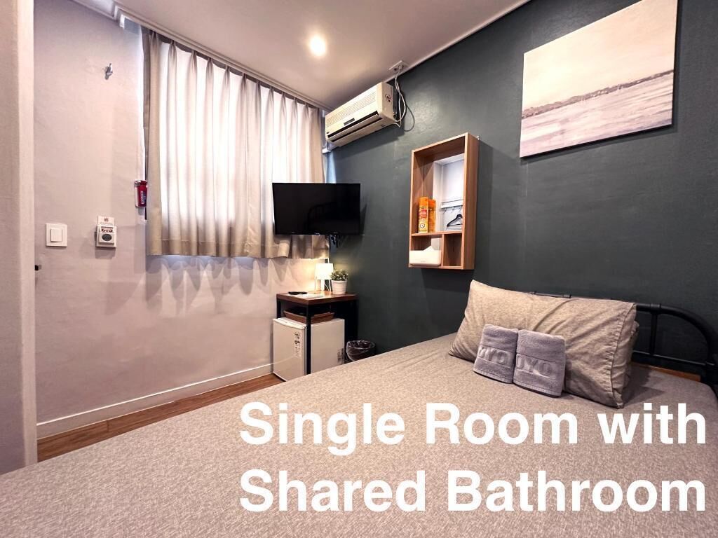 Economy Single Room, Shared Bathroom | Down comforters, Select Comfort beds, desk, blackout drapes