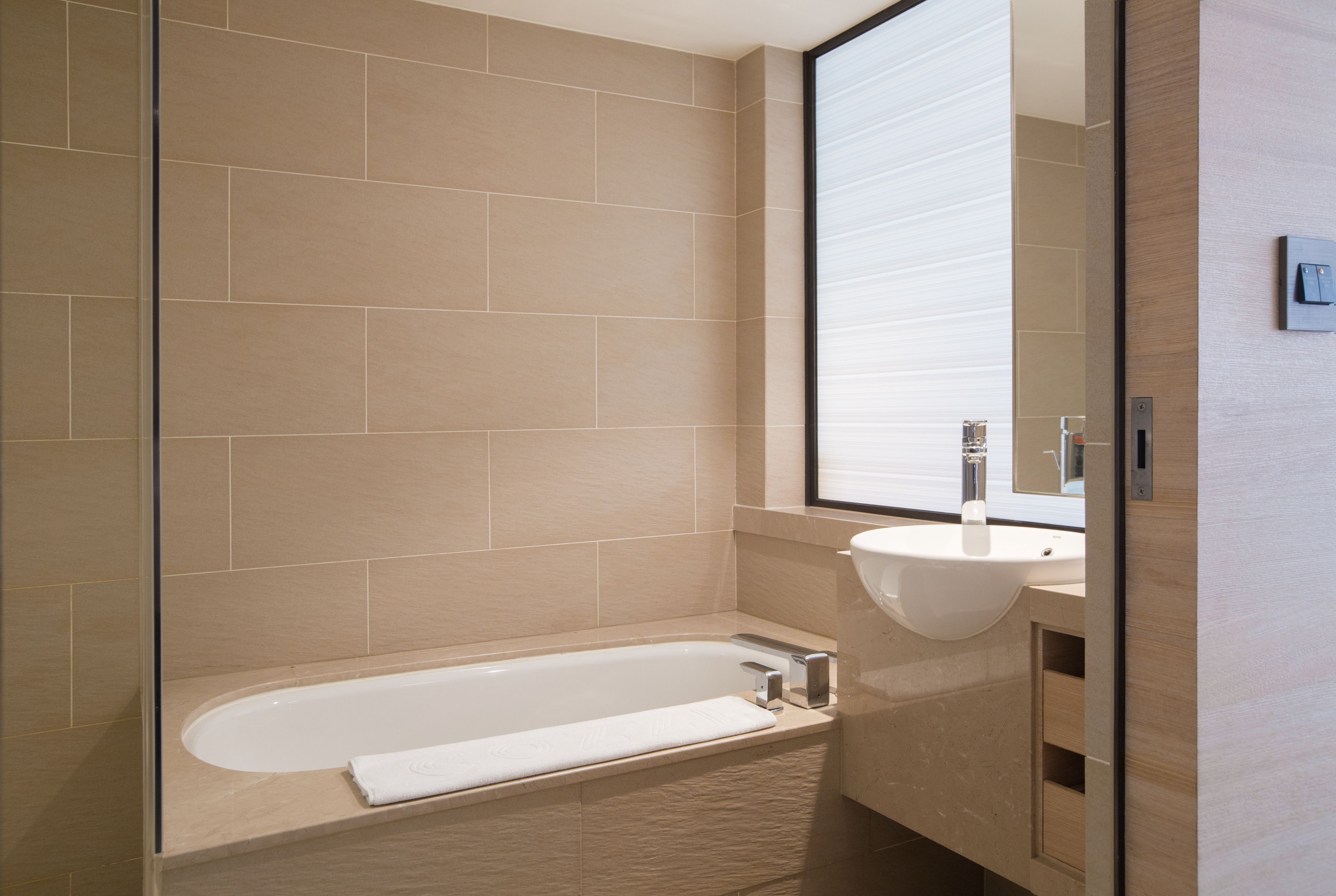 eco-friendly toiletries, hair dryer, slippers, towels