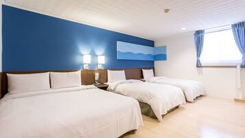 A hotel room with two beds, a nightstand with a lamp, a painting on the wall, and a window with curtains.
