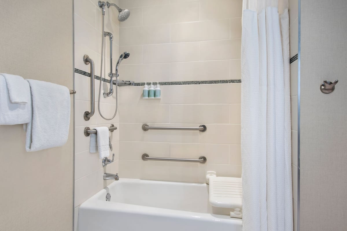Combined shower/tub, designer toiletries, hair dryer, towels