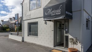 A two-story building with a sign that reads "Merivale Court Motel" and a reception area. - Merivale Court Motel (Christchurch)